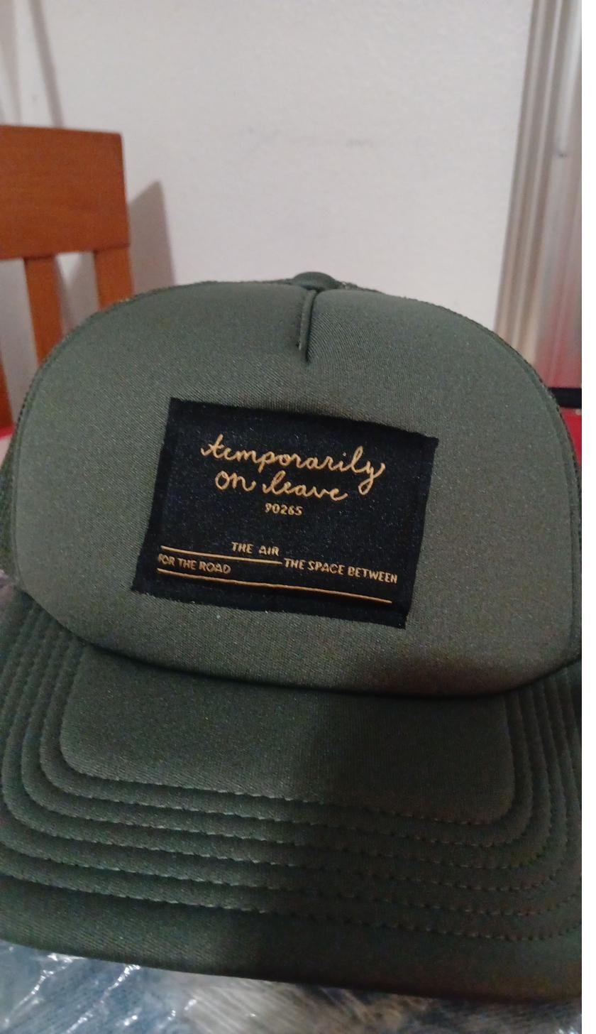 Green cap with embroidered patch
